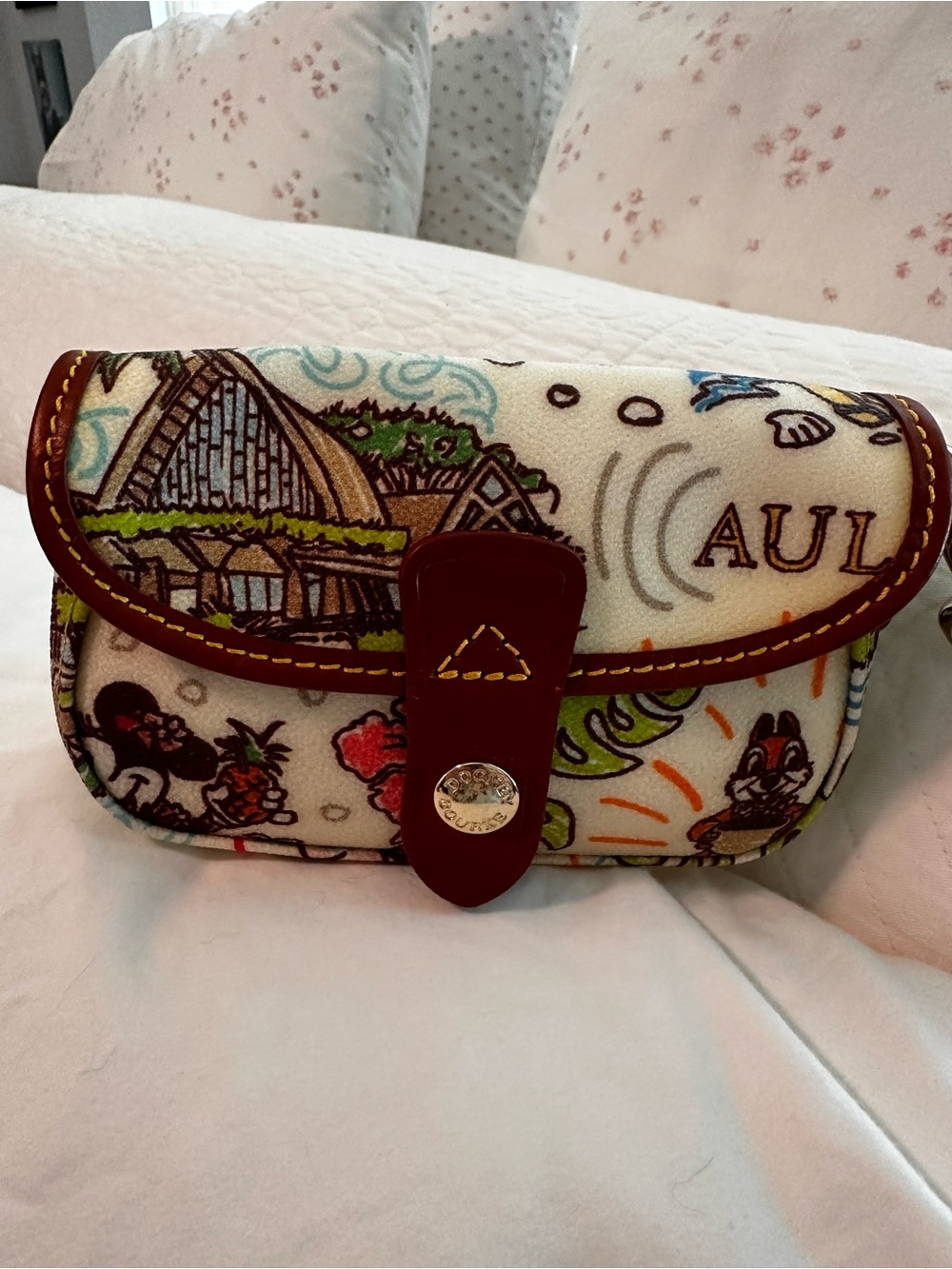 Dooney & Bourke Cream Multicolor Disney Aulani Wristlet with Brown Trim